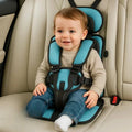 Foldable child car seat with padded head support and front harness fitted in a vehicle