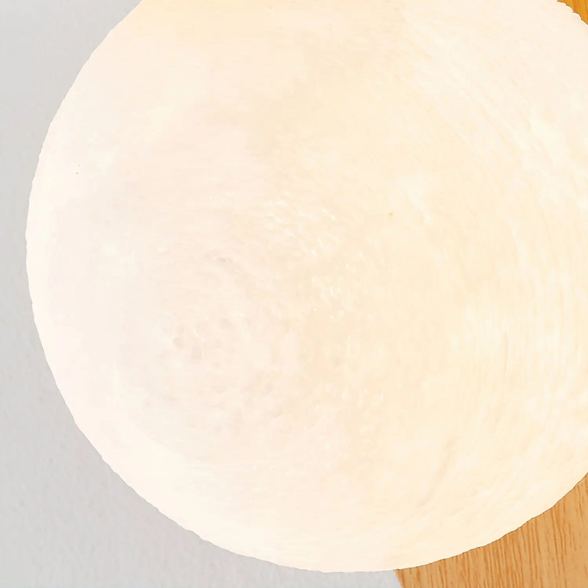 Japandi LED wall light with round globe shade and curved wood-effect panel