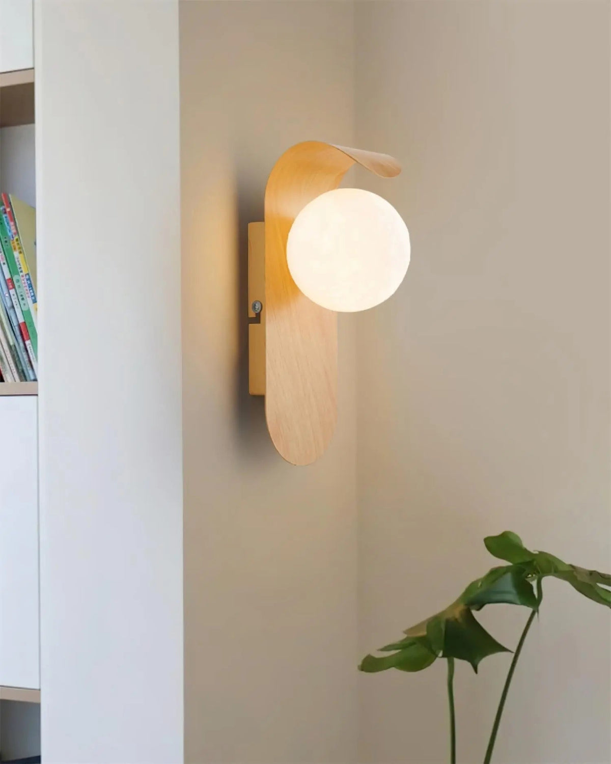 Japandi LED wall light with round globe shade and curved wood-effect panel