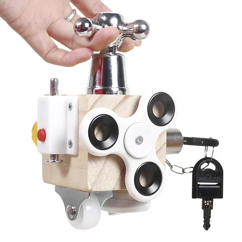 Busy cube activity toy with wood-effect panels, spinner, bell and moving parts