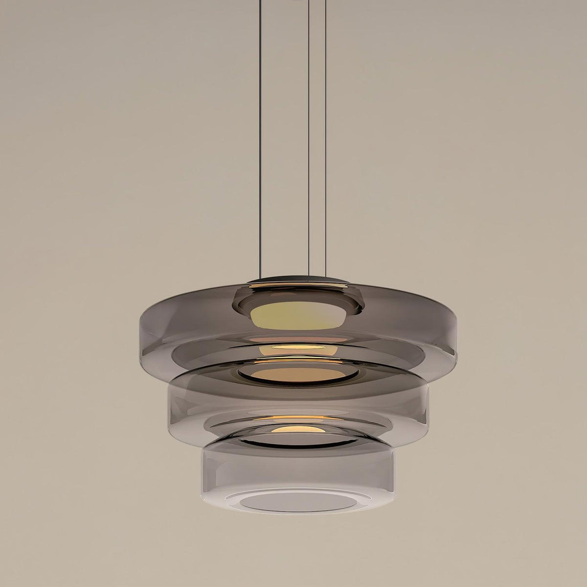 Rounded glass pendant light suspended from a black ceiling canopy