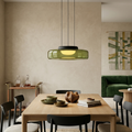 Rounded glass pendant light suspended from a black ceiling canopy