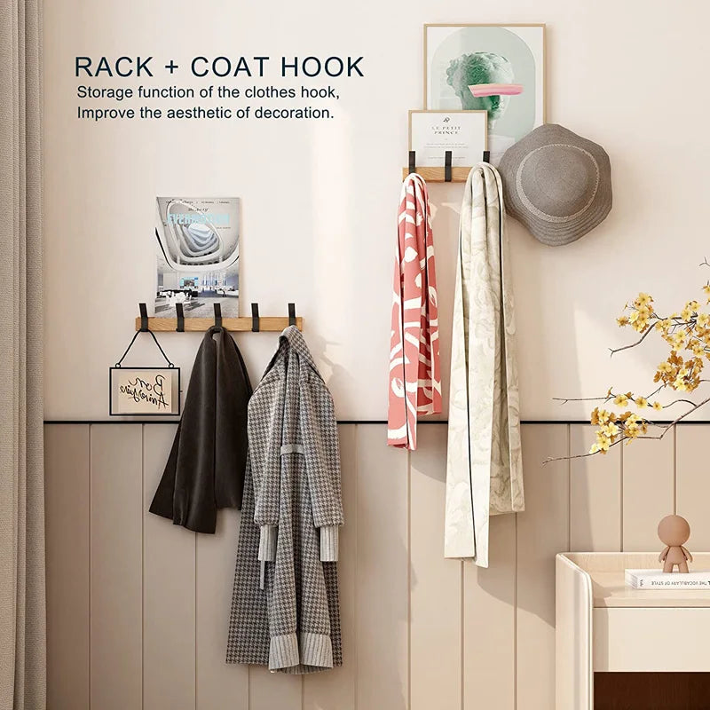 Wall-mounted coat rack with black hooks and a wood-effect bar
