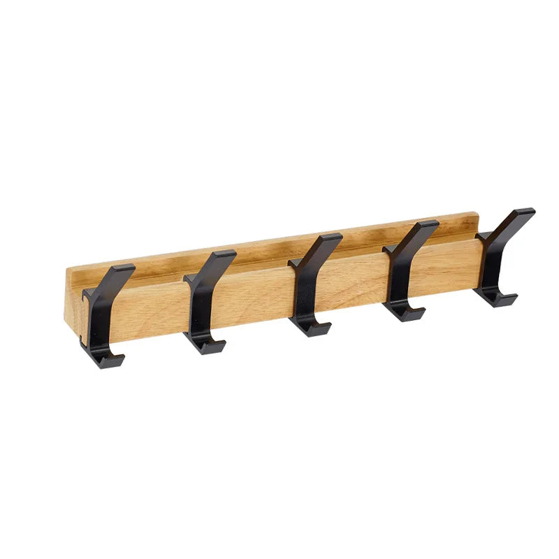 Wall-mounted coat rack with black hooks and a wood-effect bar