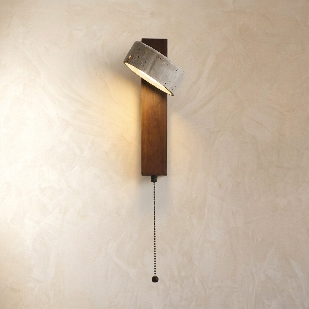Adjustable travertine-effect wall light with angled shade and wood-effect backplate