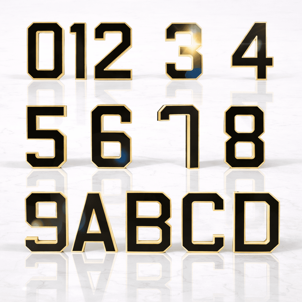 Black solar-powered illuminated house letter lamp with warm white outline