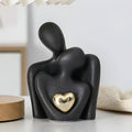 Ceramic couple figurine with a heart detail