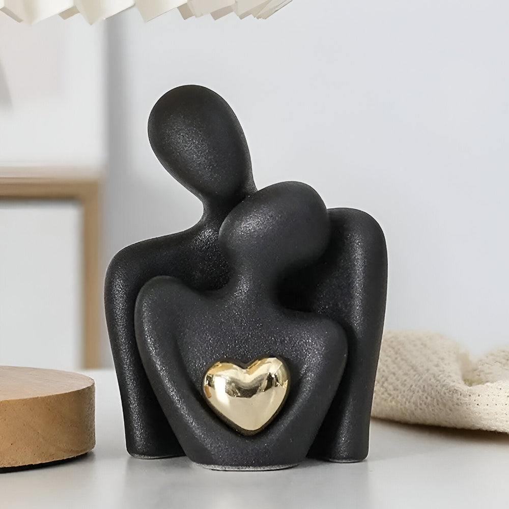 Ceramic couple figurine with a heart detail
