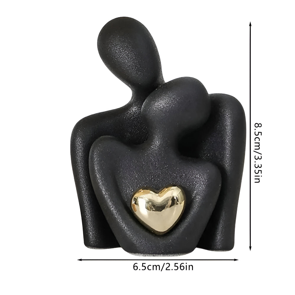 Ceramic couple figurine with a heart detail
