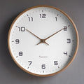 Round wall clock with large dark numerals and a wood-effect rim