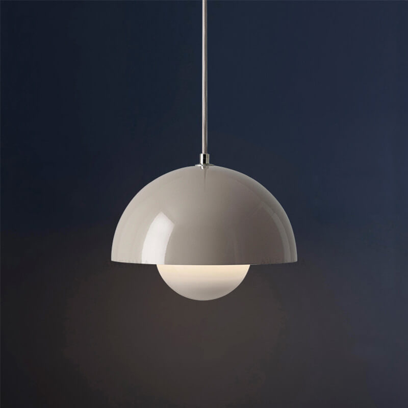 Pendant ceiling light with a half-dome shade and spherical lower diffuser