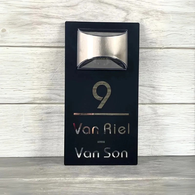 Personalised rectangular house number plaque with raised address lettering and curved upper panel