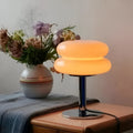 Glass table lamp with two-tier rounded shade and chrome-effect stand