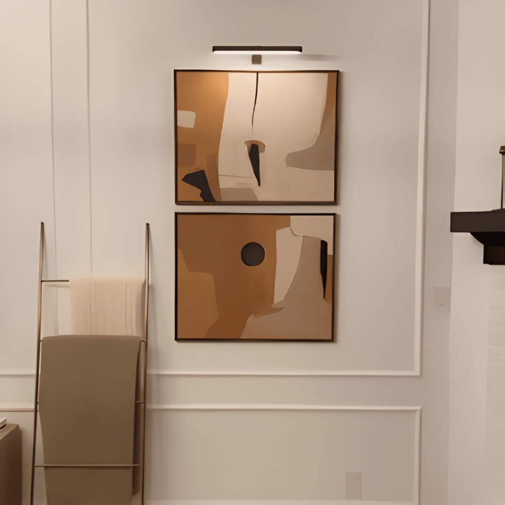 Cordless rotatable LED picture light mounted above framed artwork