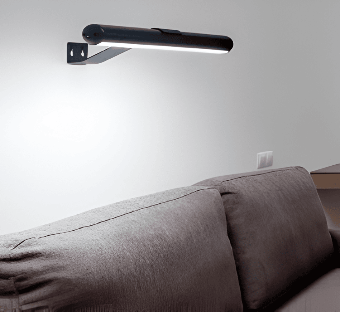 Cordless rotatable LED picture light mounted above framed artwork
