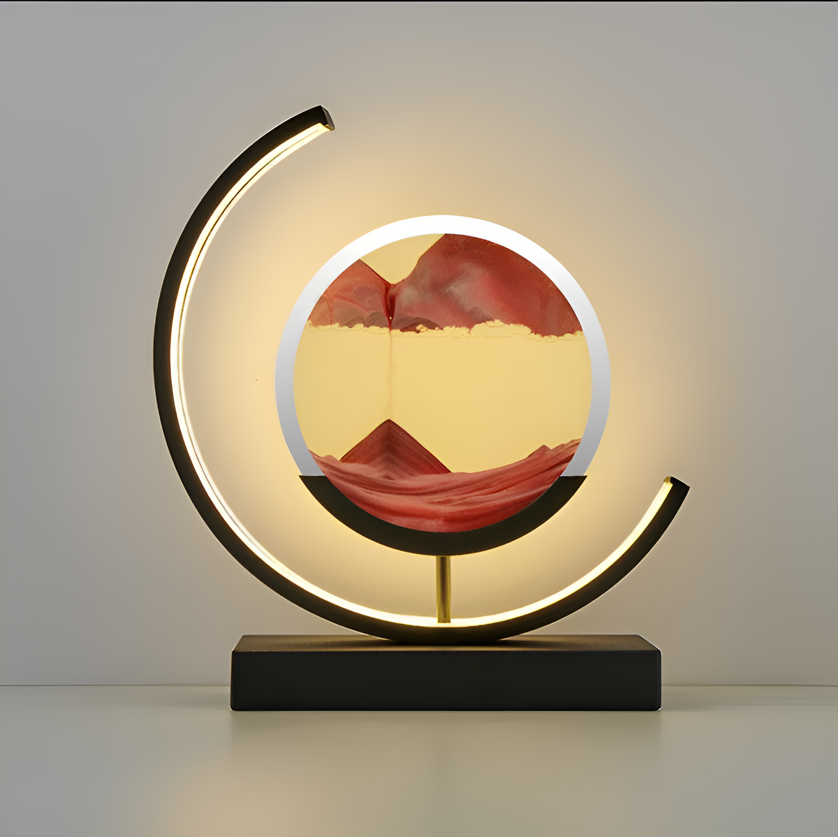 Decorative sand art table lamp with circular illuminated frame and rectangular base