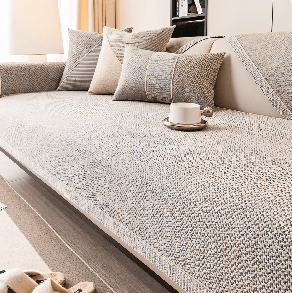 Textured non-slip sofa cover with piped edging on living room seating
