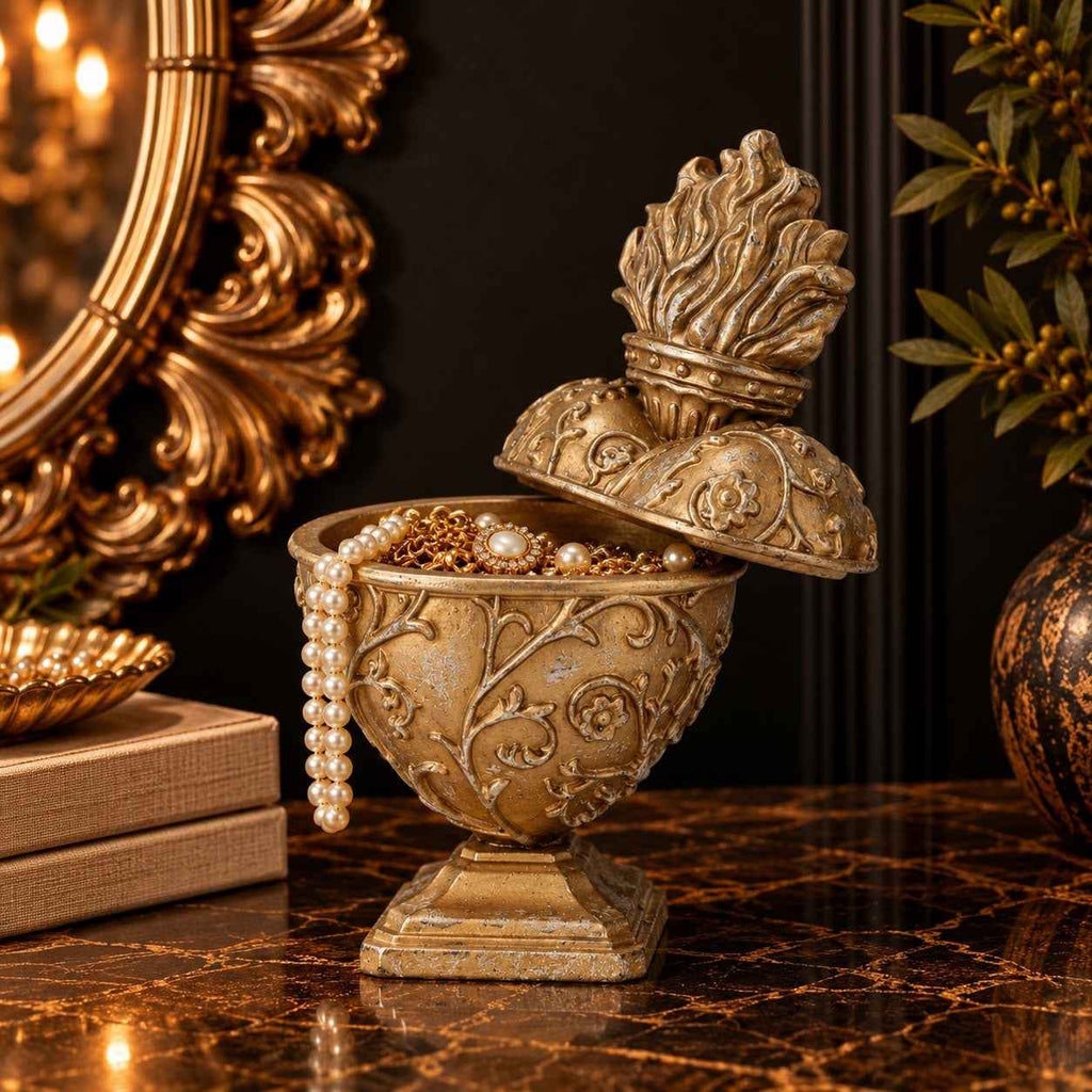 Gold resin Sacred Heart trinket box with ornate detailing and flame-shaped lid
