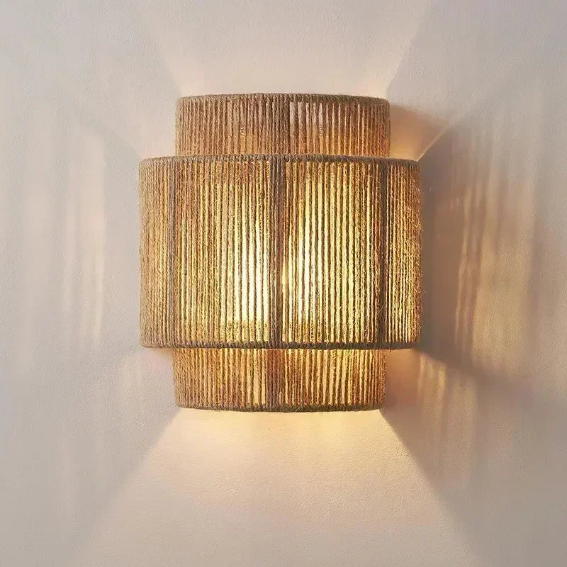 Brown woven rattan wall lamp with layered cylindrical shade