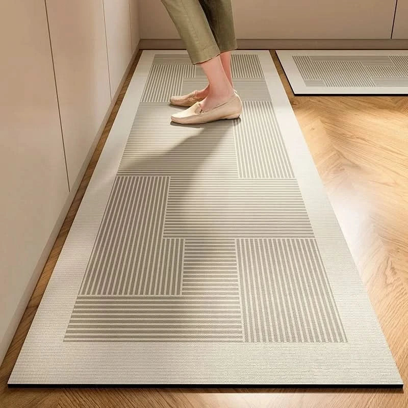 Gray striped cushioned non-slip kitchen mat on a wooden floor