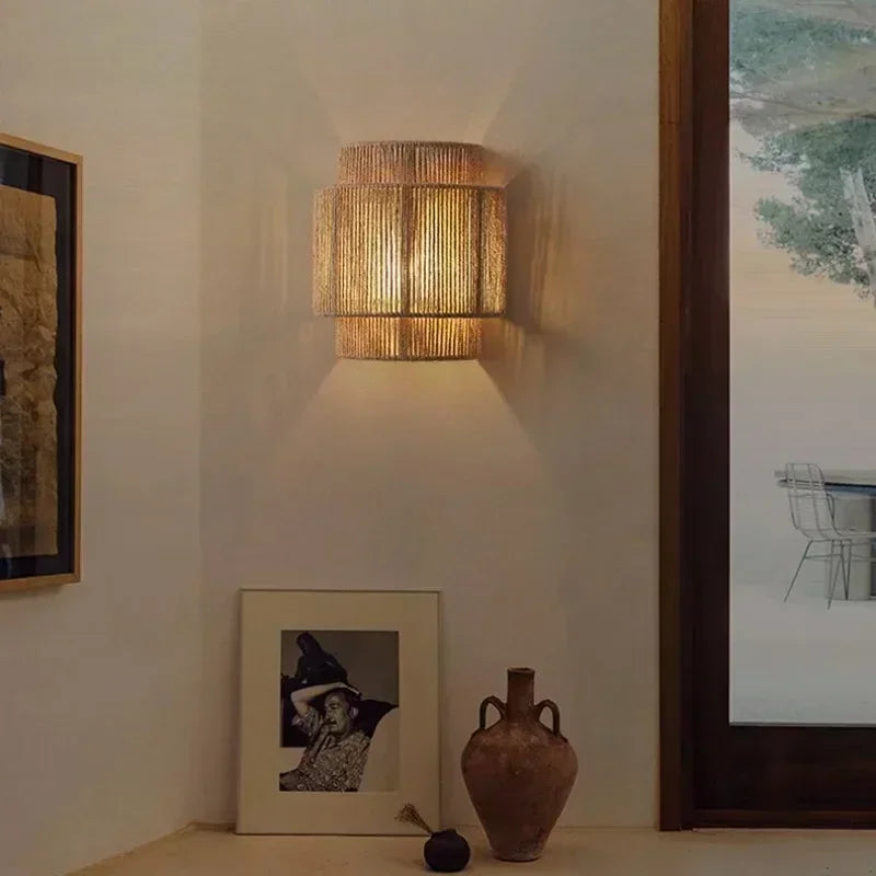 Brown woven rattan wall lamp with layered cylindrical shade