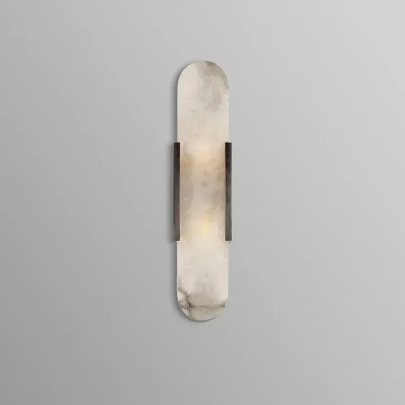 Vertical LED wall sconce with a light marble panel and contrasting side rails