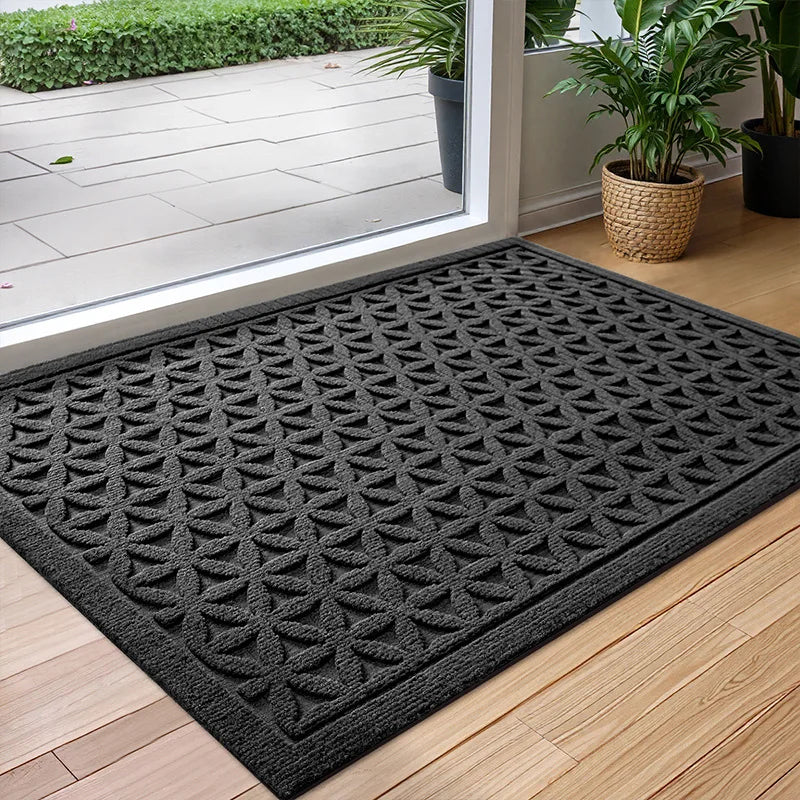 Rectangular textured geometric door mat at an entrance