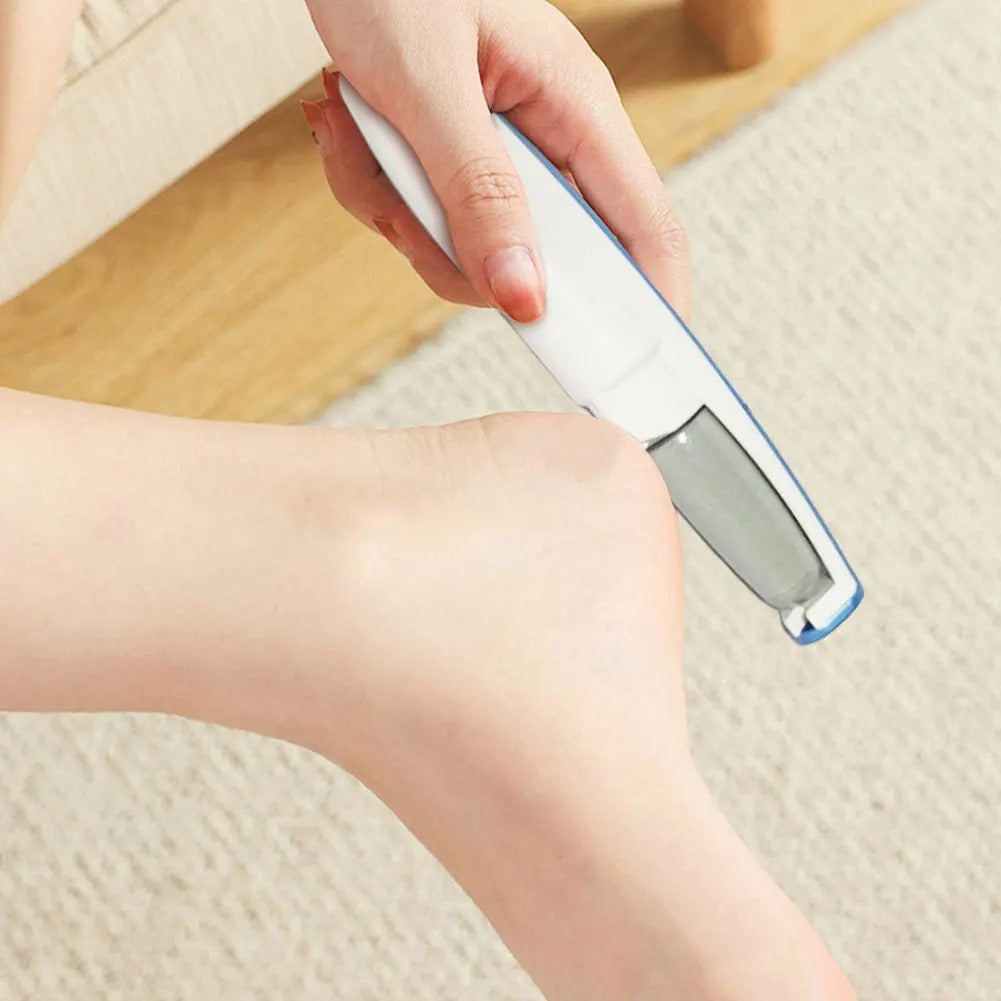 Handheld electric callus remover with capped top and power button