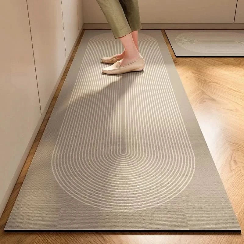 Gray striped cushioned non-slip kitchen mat on a wooden floor