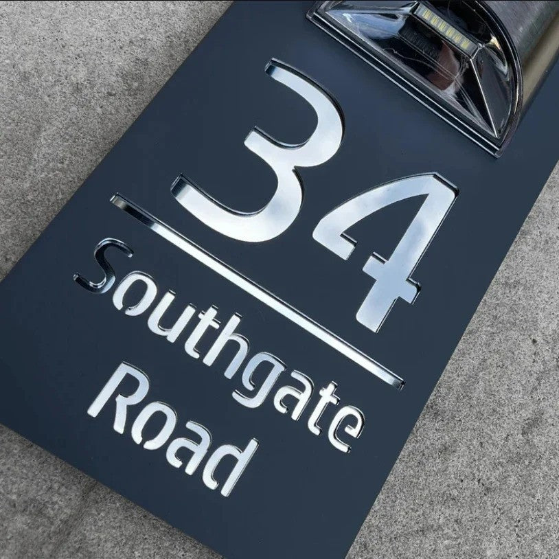 Personalised rectangular house number plaque with raised address lettering and curved upper panel