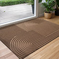 Rectangular textured geometric door mat at an entrance