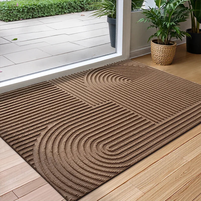 Rectangular textured geometric door mat at an entrance