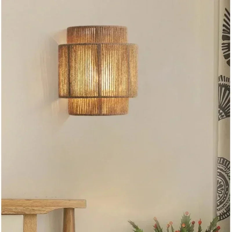 Brown woven rattan wall lamp with layered cylindrical shade