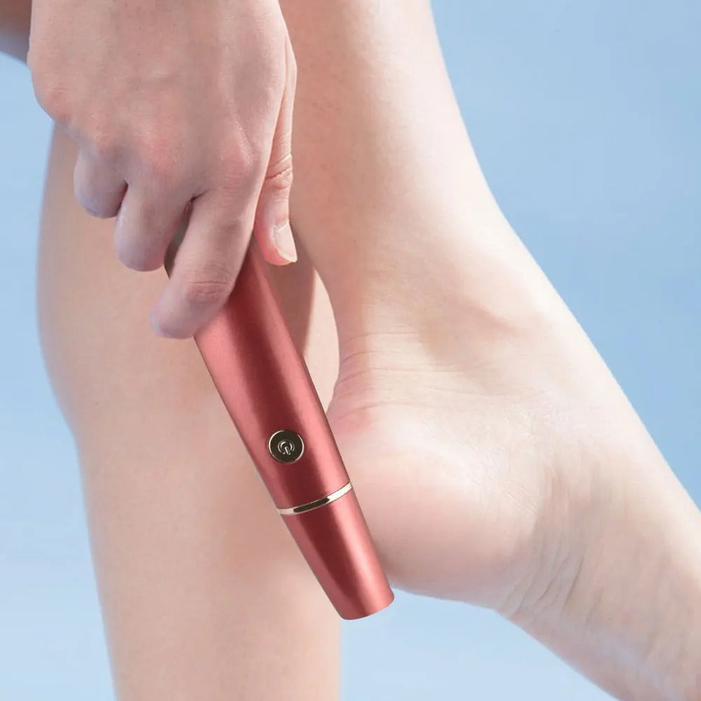 Handheld electric callus remover with capped top and power button