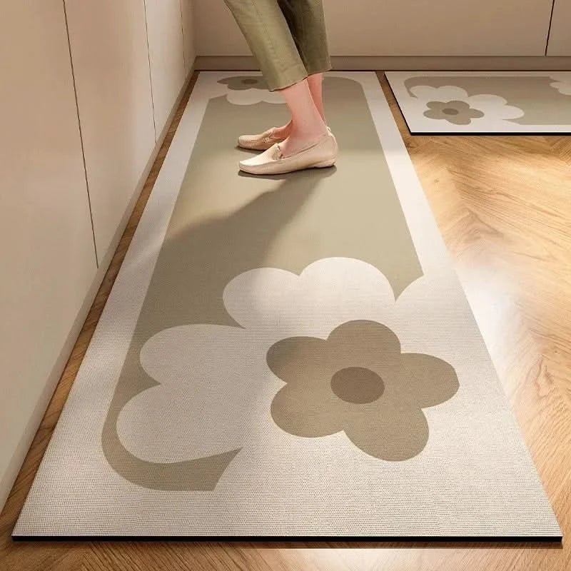 Gray striped cushioned non-slip kitchen mat on a wooden floor