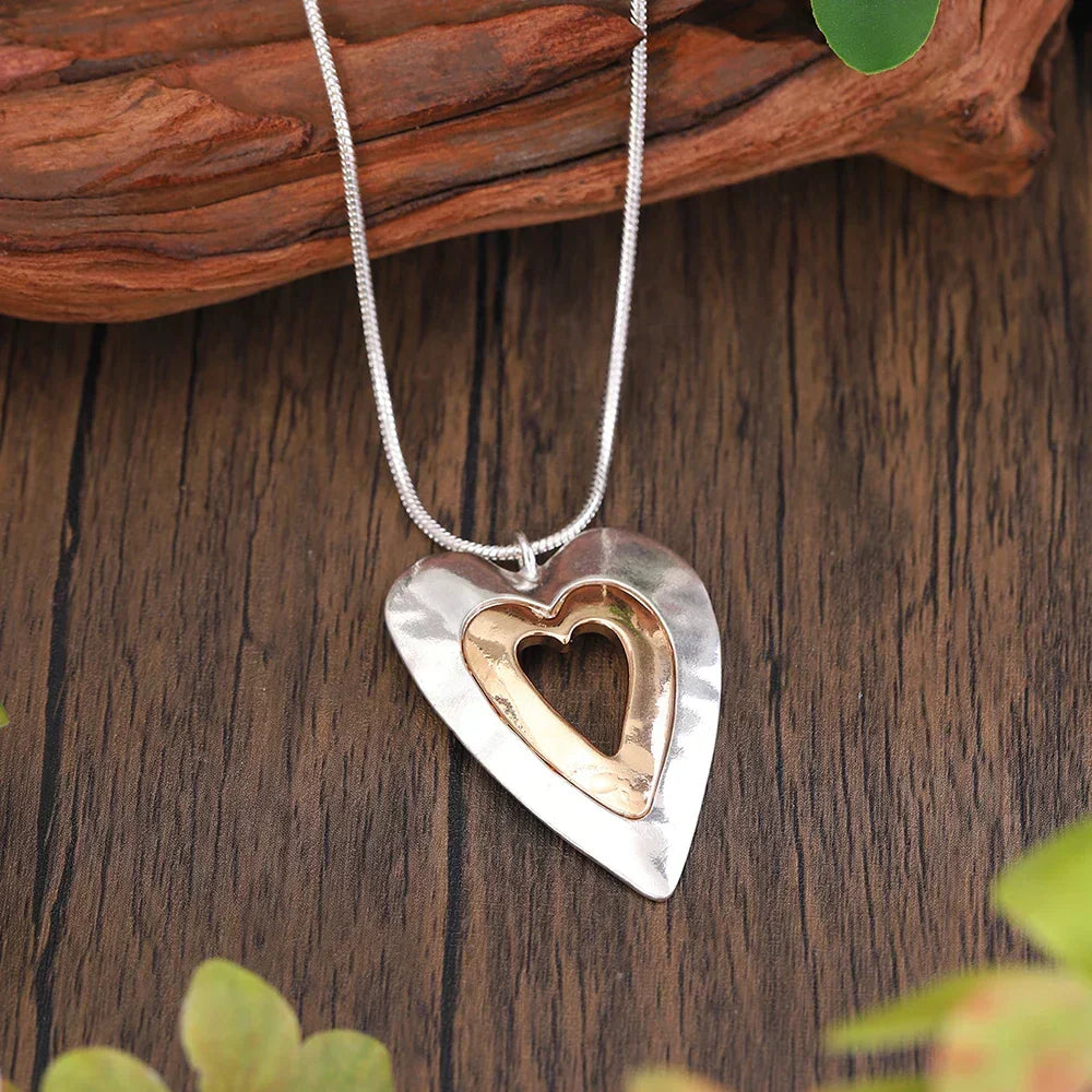 Silver chain necklace with two-tone heart pendant