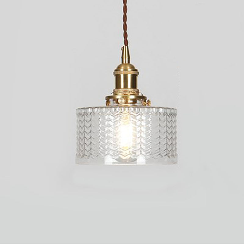 Round patterned glass pendant light with brass fitting and twisted cord