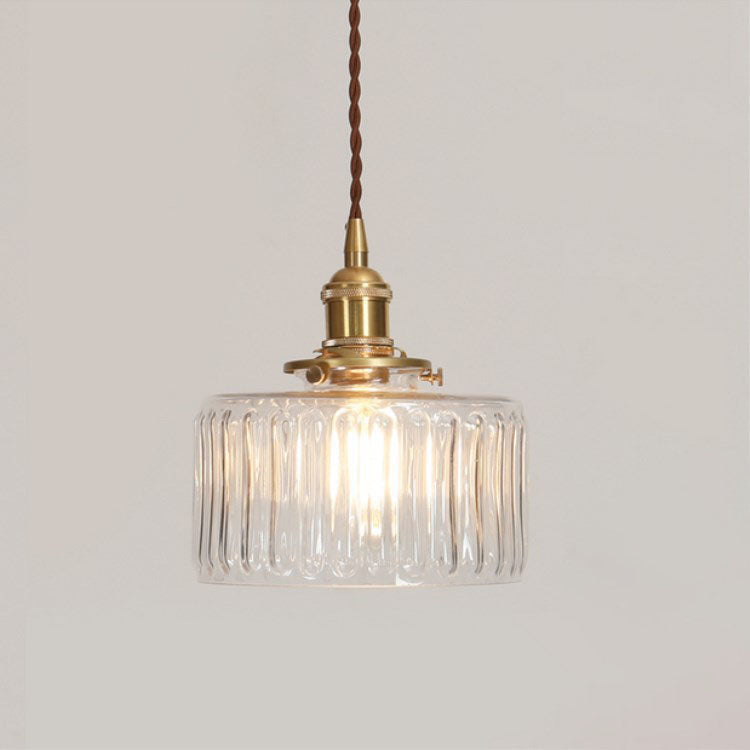 Round patterned glass pendant light with brass fitting and twisted cord