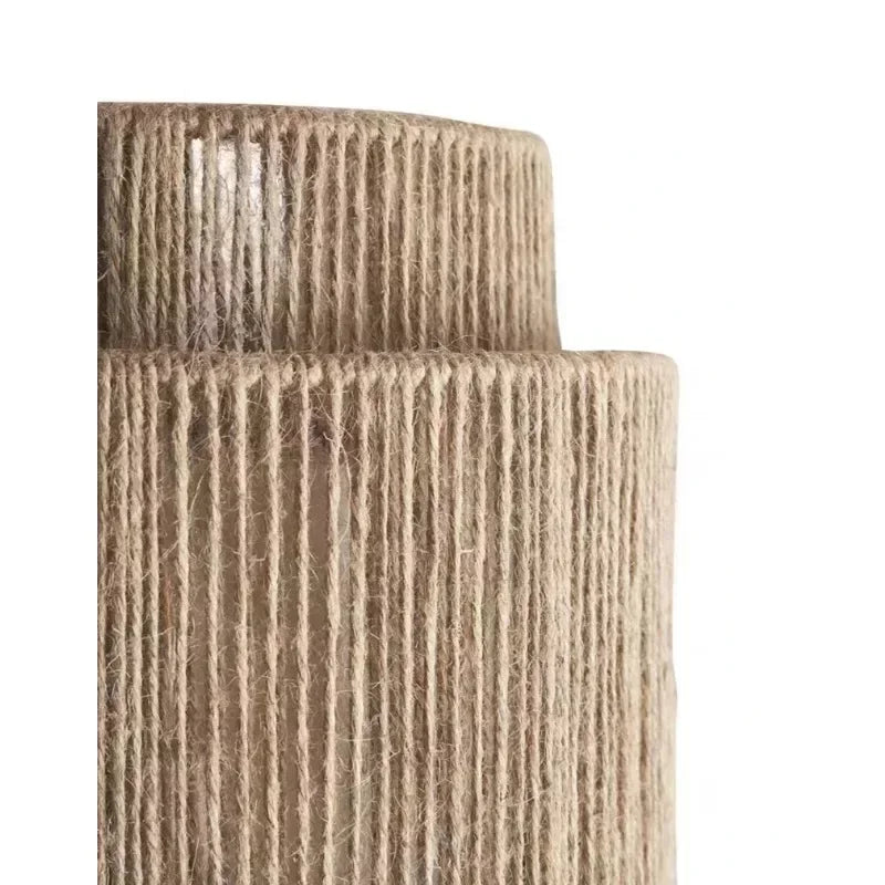 Brown woven rattan wall lamp with layered cylindrical shade