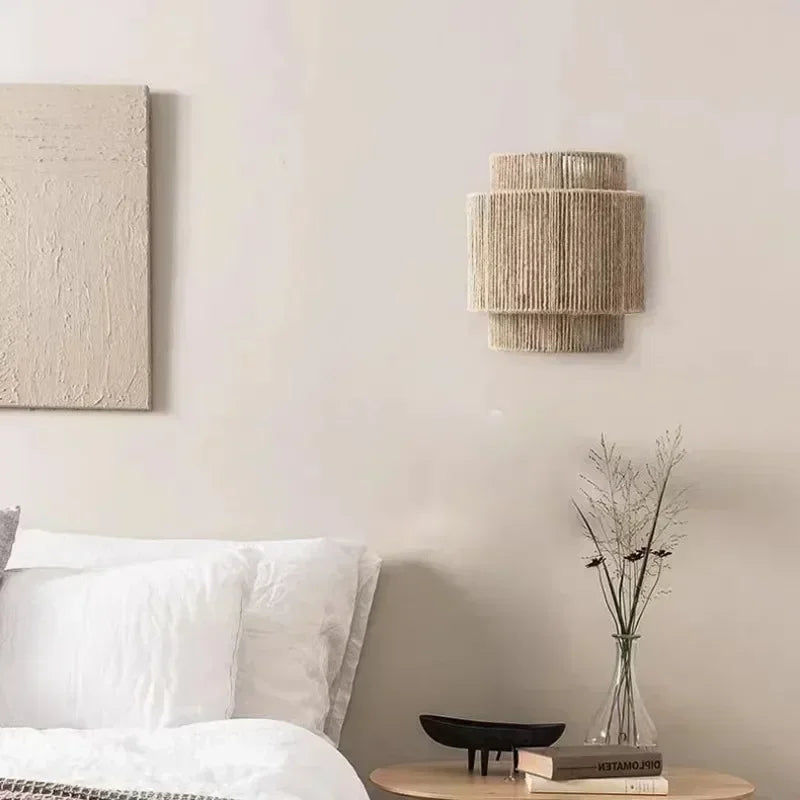 Brown woven rattan wall lamp with layered cylindrical shade
