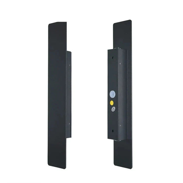Black vertical outdoor LED wall light casting warm white light upward and downward