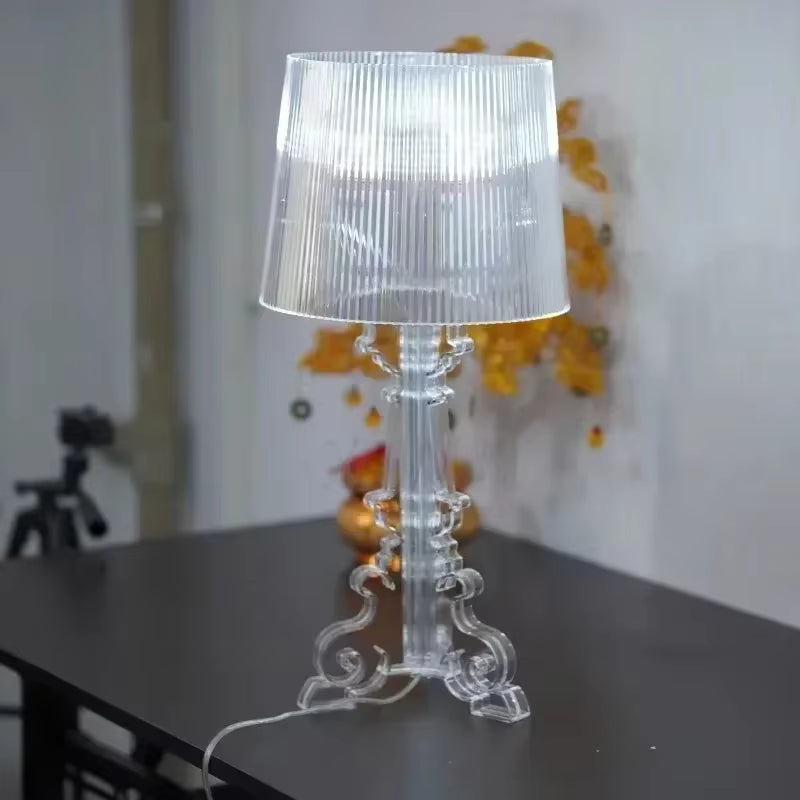 Baroque-style table lamp with ribbed shade and ornate decorative base