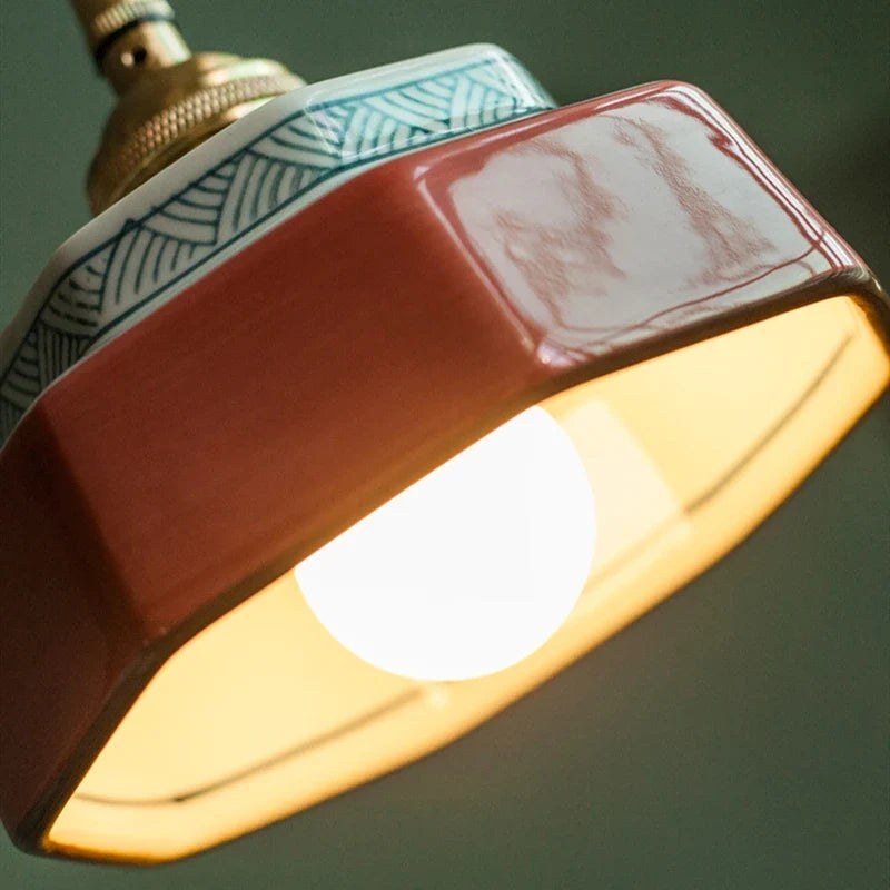 Geometric pendant lamp with patterned shade, copper-tone fitting and braided cord