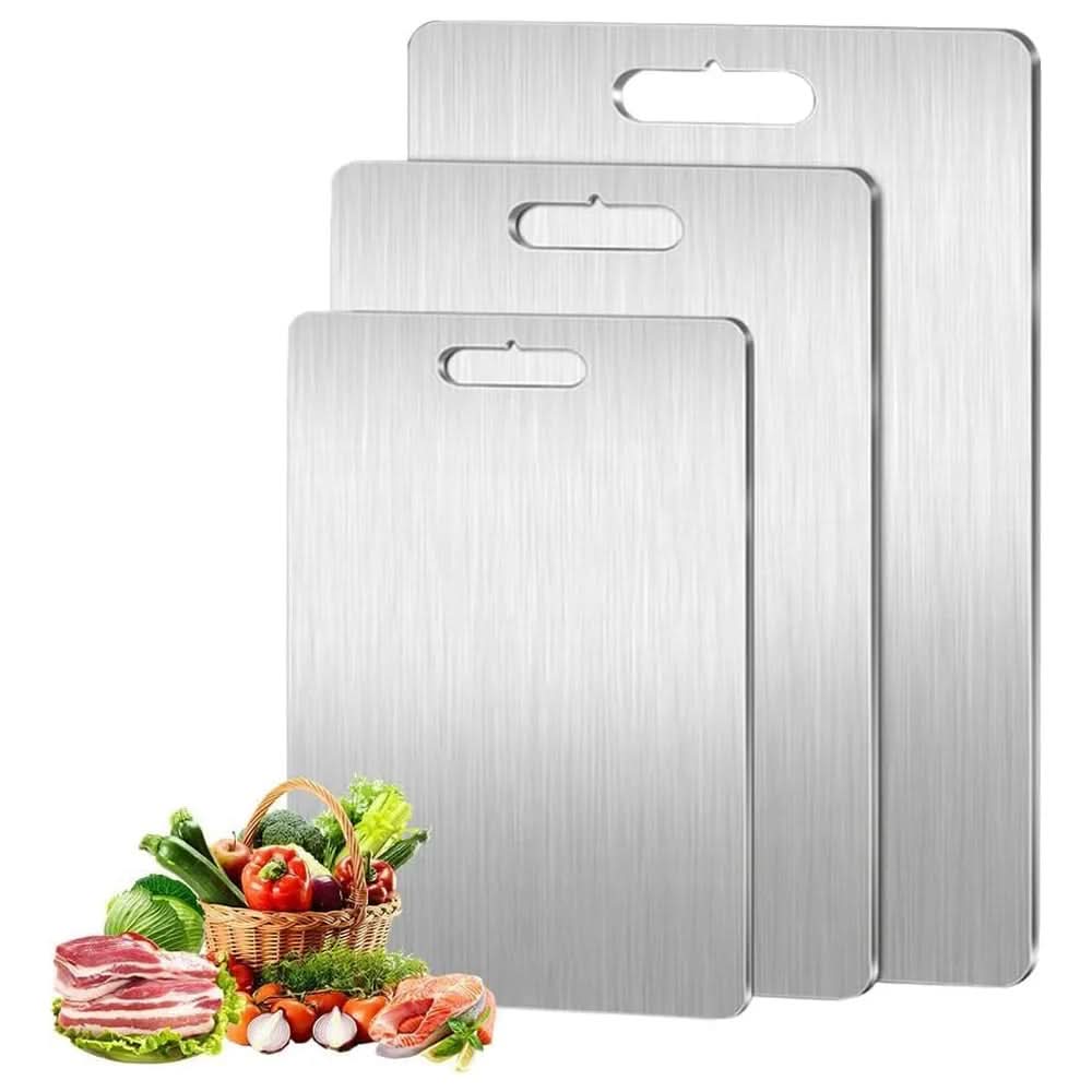 Set of three rectangular silver cutting boards with brushed finish and handle openings