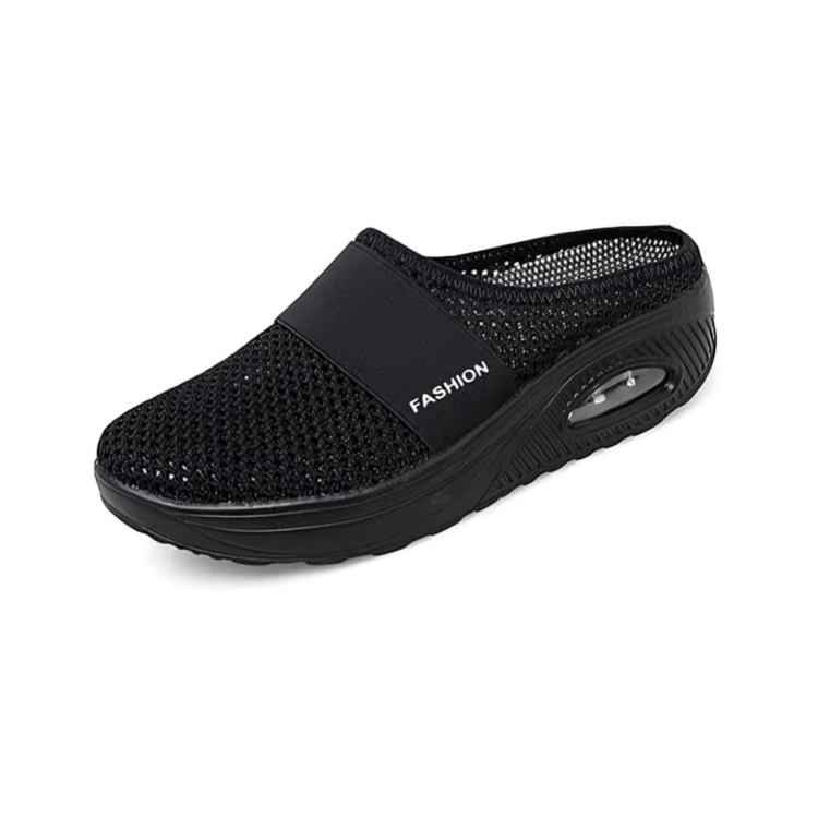 Closed-toe slip-on clog with perforated upper, broad strap and thick textured sole
