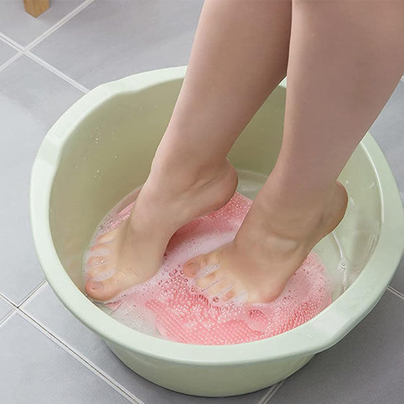 Handheld shower body scrubber with dense flexible bristles and hanging hole