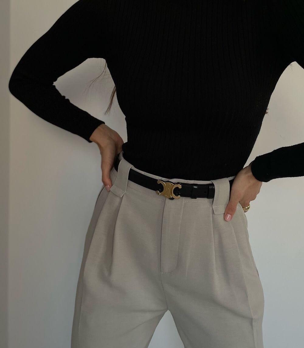 Belt with decorative curved buckle and adjustment holes