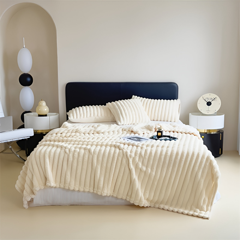 Plush ribbed fleece throw blanket draped over a chair