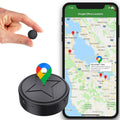 Black round magnetic GPS tracker with USB port and SIM slot marking