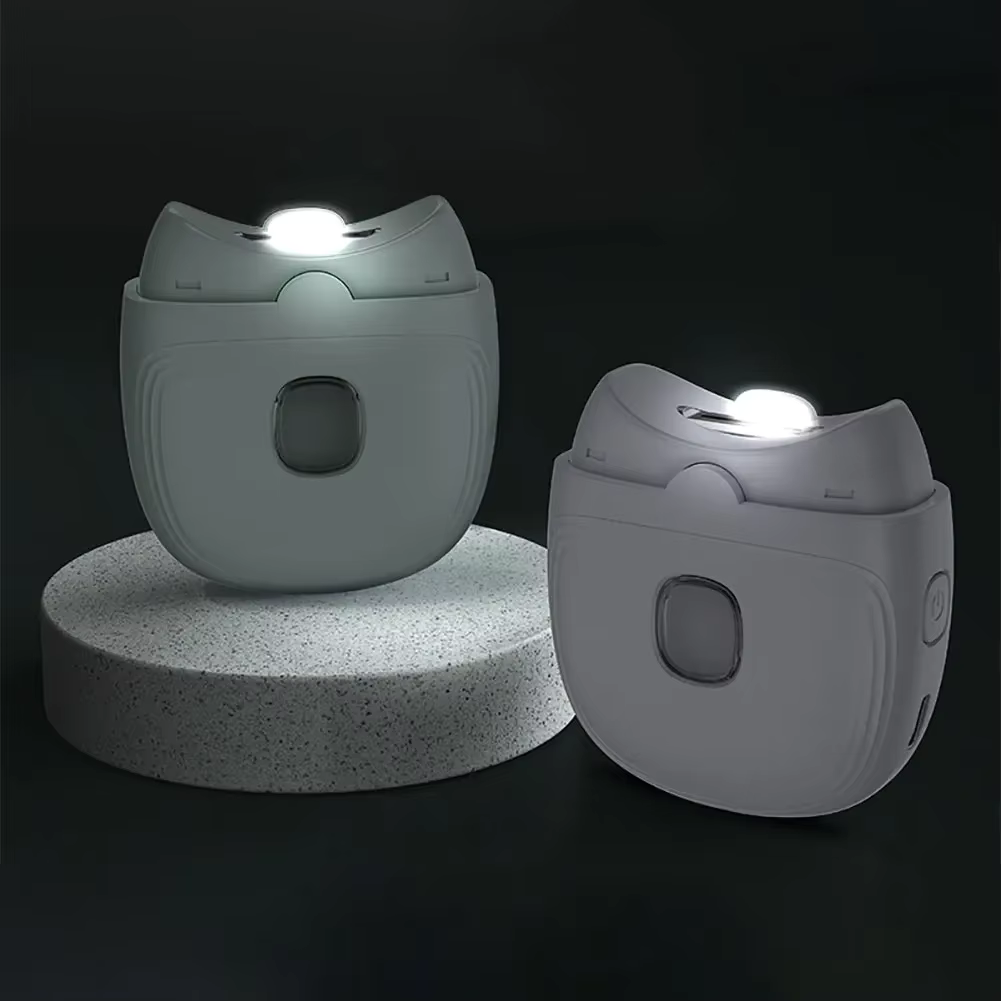 Portable electric nail clipper with cat face housing and transparent lower section